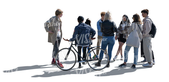 backlit group of teenagers standing