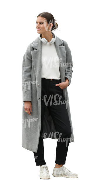 woman in a grey overcoat standing