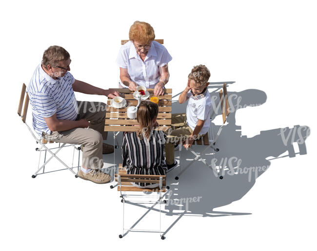 top view of grandparents sitting in a cafe with their grandkids