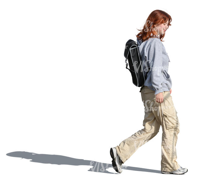 young woman with a backpack walking