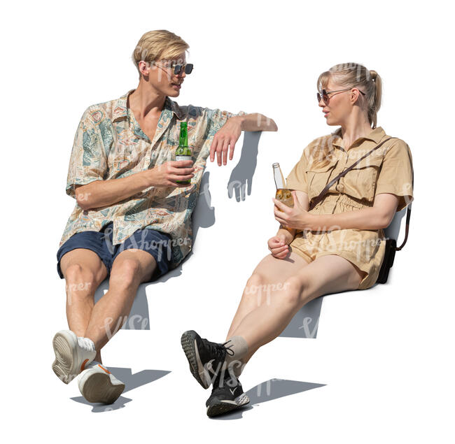 man and woman sitting and drinking drinks