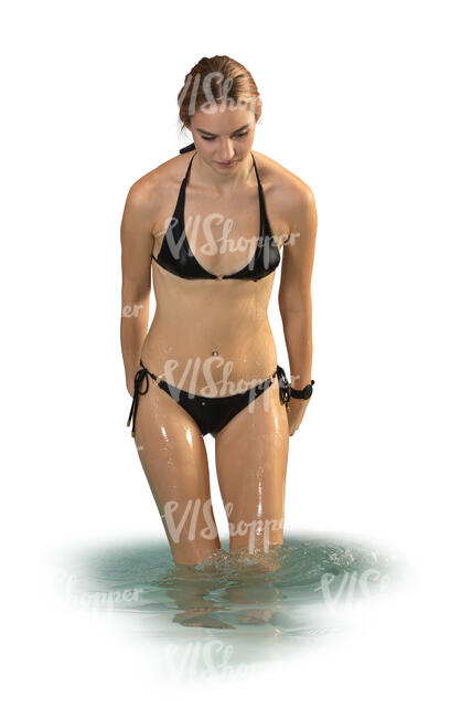 woman in a bathing suit coming out of the water