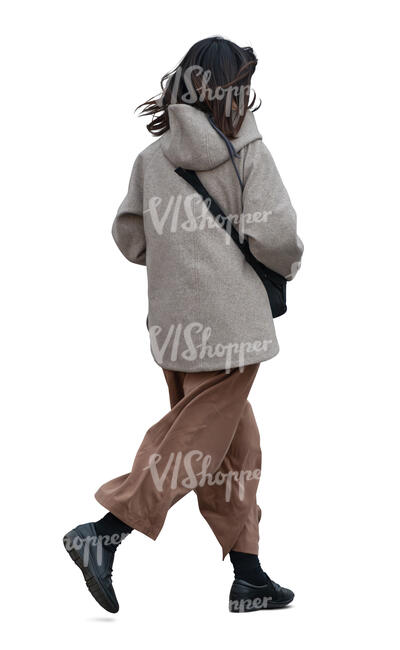 asian woman wearing a hooded jacket walking