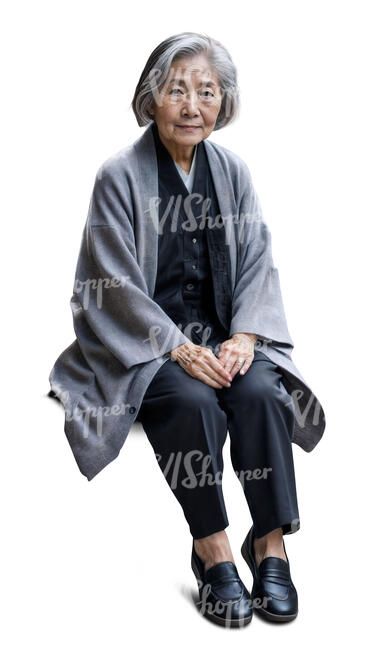 elderly asian woman wearing a grey jacket sitting