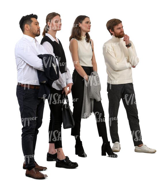 group of four people standing and looking at smth