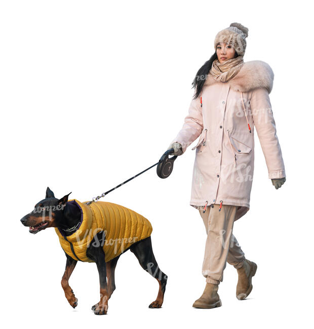 woman in winter walking her dog