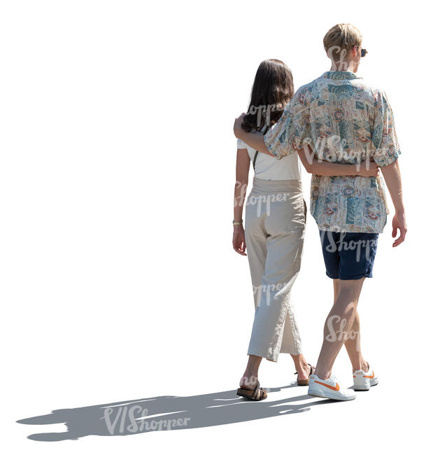 backlit couple in summer walking