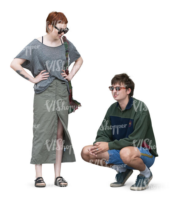 woman standing and man squatting