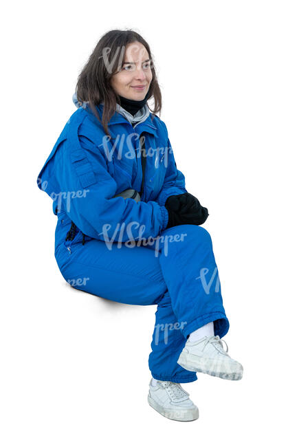 woman in a blue ski costume sitting