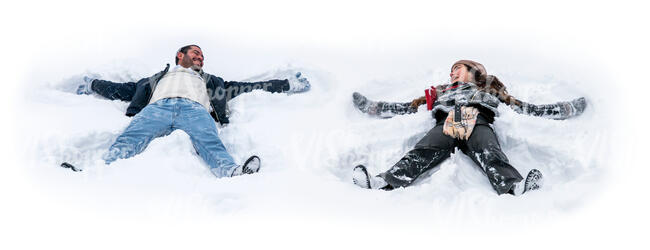 man and woman lying in the snow