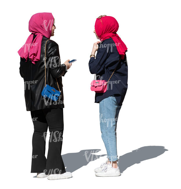 two muslim women standing and talking