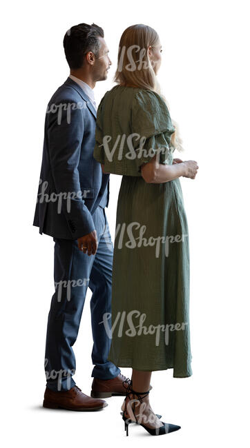 ambient backlit man and woman in formal outfits standing by a window