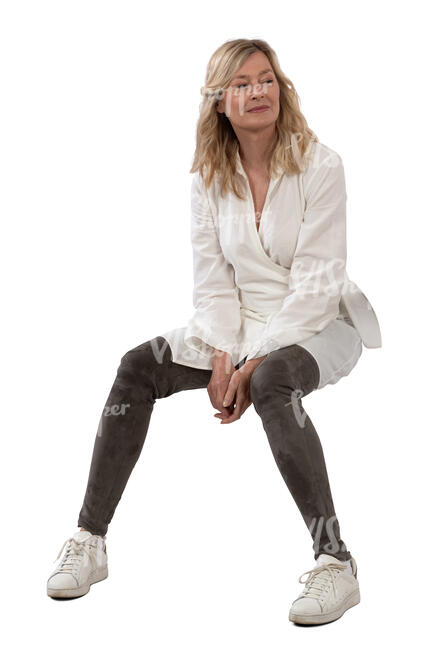 woman wearing a white blouse sitting