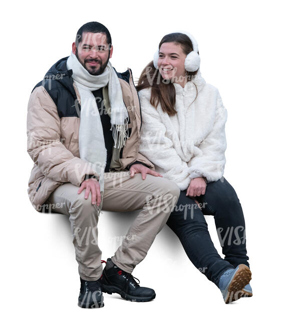 man and woman in winter sitting