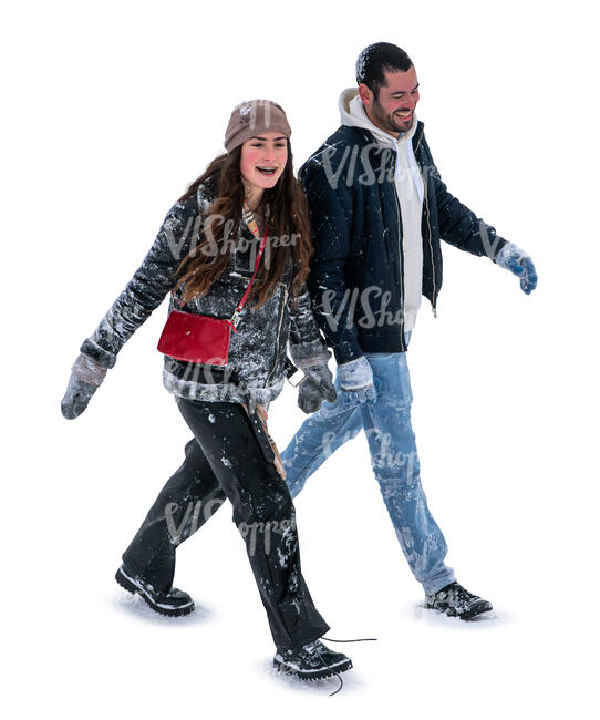 man and woman covered with snow walking seen from above