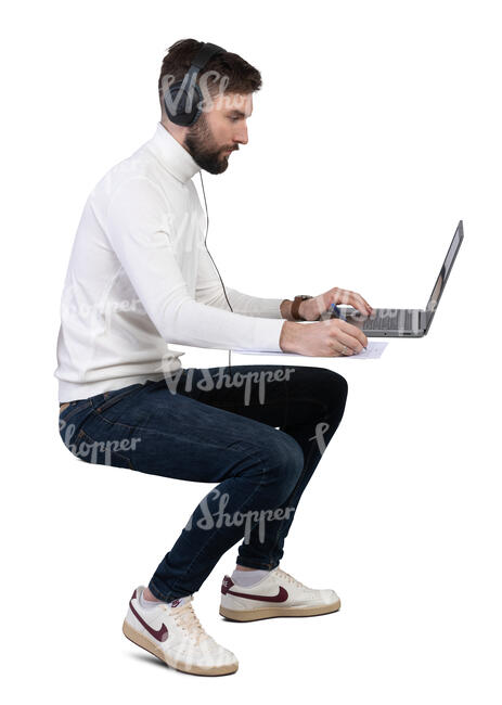 man with headphones working with computer