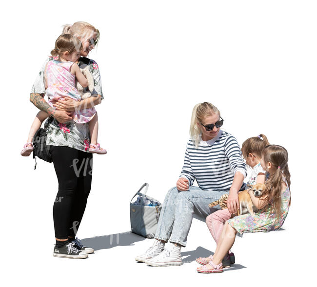 two cut out women with their daughters sitting and standing