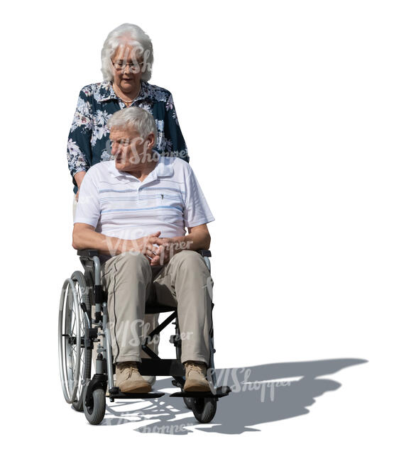 woman pushing an older man sitting in a wheelchair
