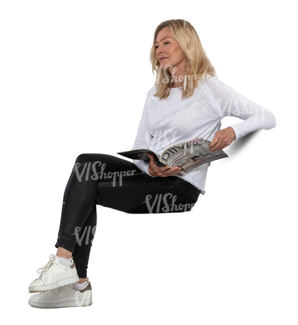 middle aged woman sitting and reading a magazine