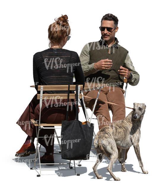cut out man and woman and a dog sitting in a cafe