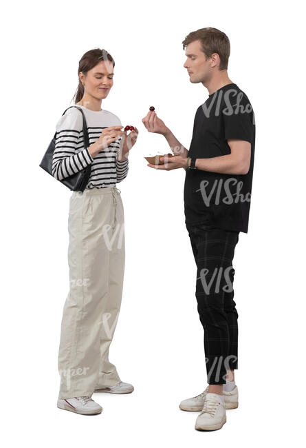 woman and man standing and eating cherries