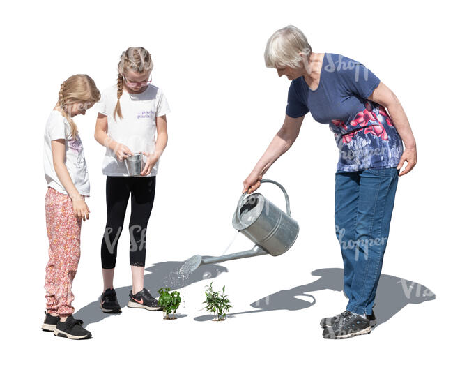 grandmother and grandkids planting in the garden