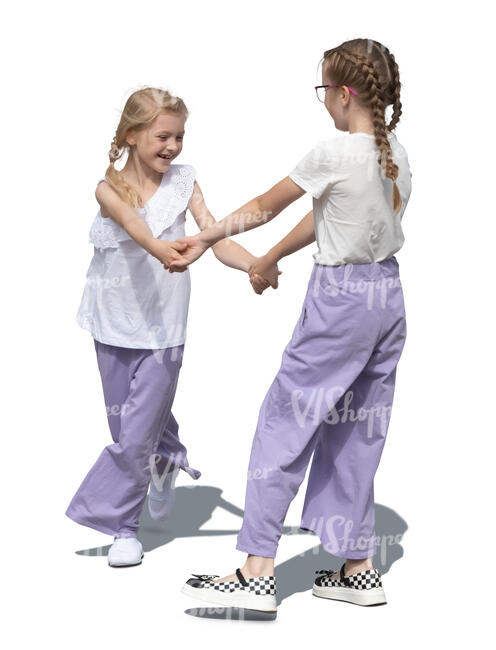 two cut out little girls dancing together