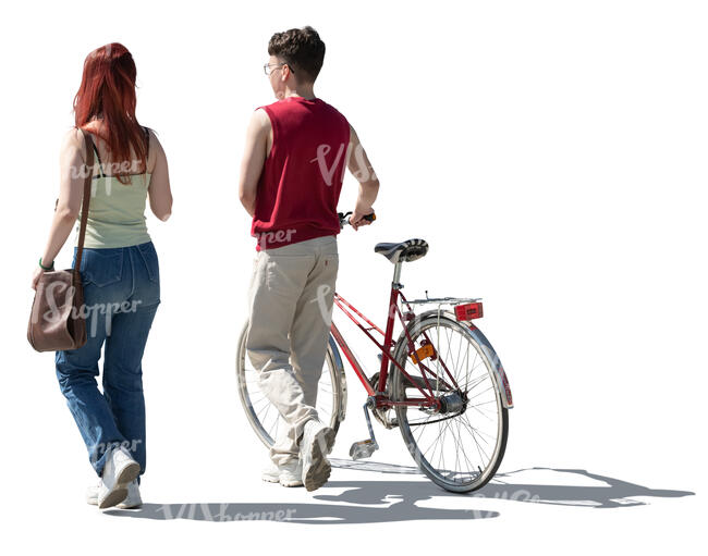 cut out backlit two teens with a bike walking