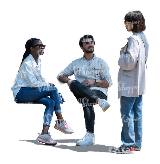 woman talking to two friends sitting in partial shade