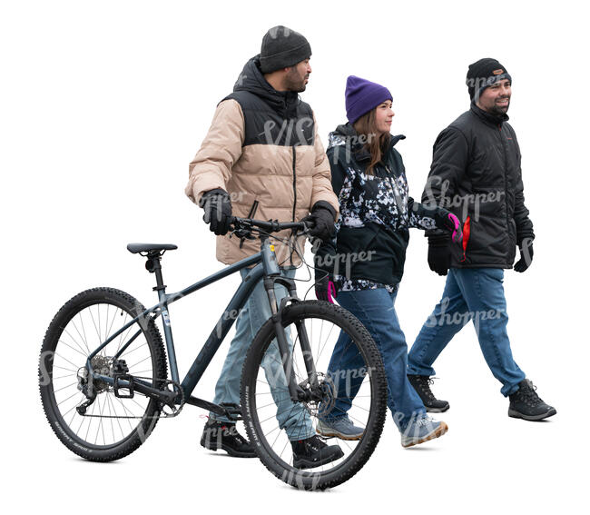 cut out group of three people with a bike walking in winter