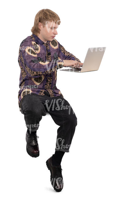 young man sitting at a counter height table and working