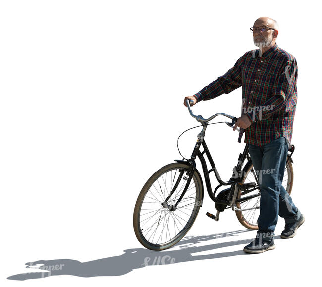 cut out backlit elderly man walking with a bike