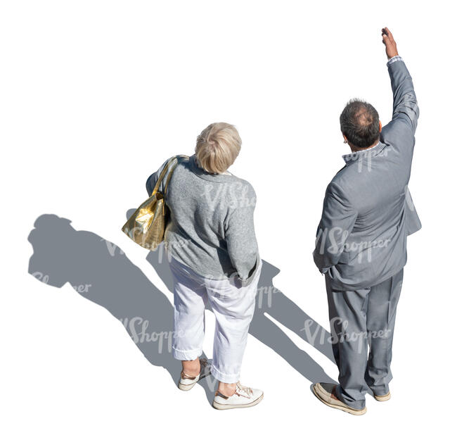 two people standing and pointing at smth seen from above