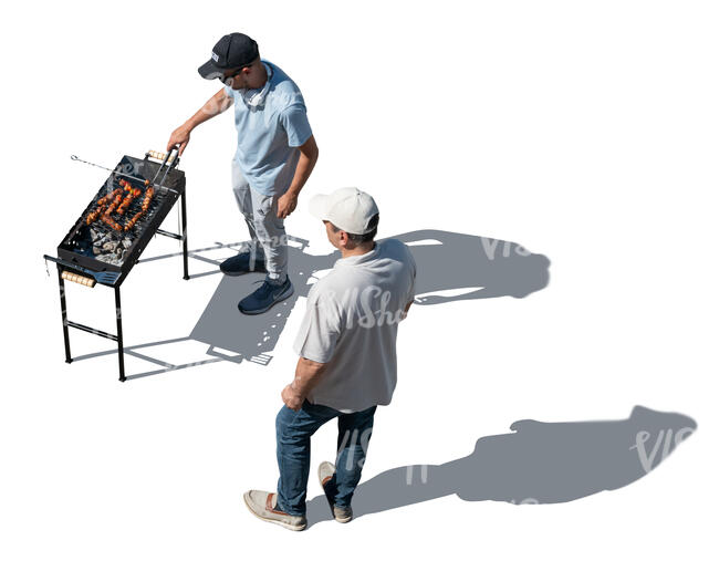 top view of two men grilling meat