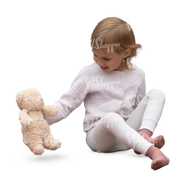 little girl sitting and playing with a toy