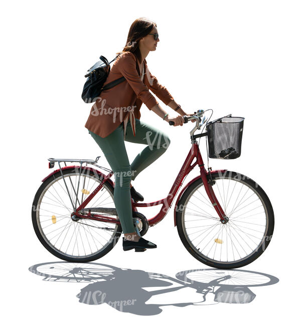 cut out backlit woman riding a bike