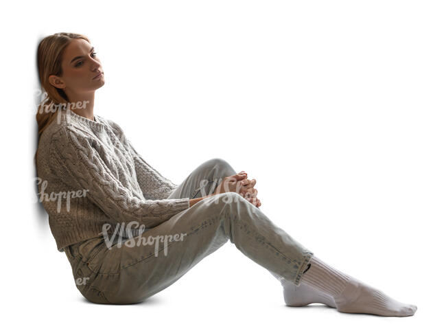 backlit woman sitting by the window