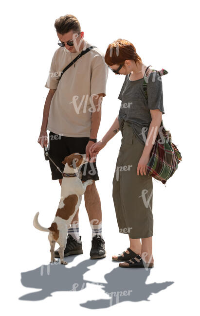 backlit man and woman petting a dog