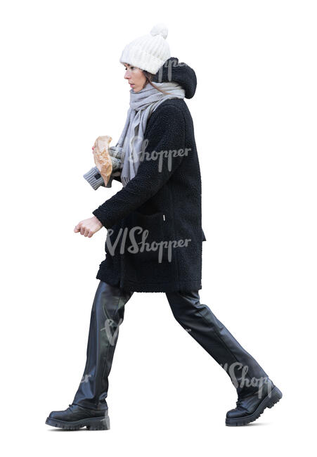cut out young woman walking and eating a sandwich