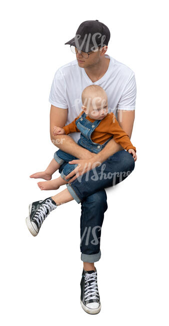 top view of a man sitting and holding a baby