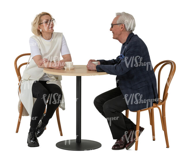 cut out elderly couple sitting in a cafe and drinking coffee