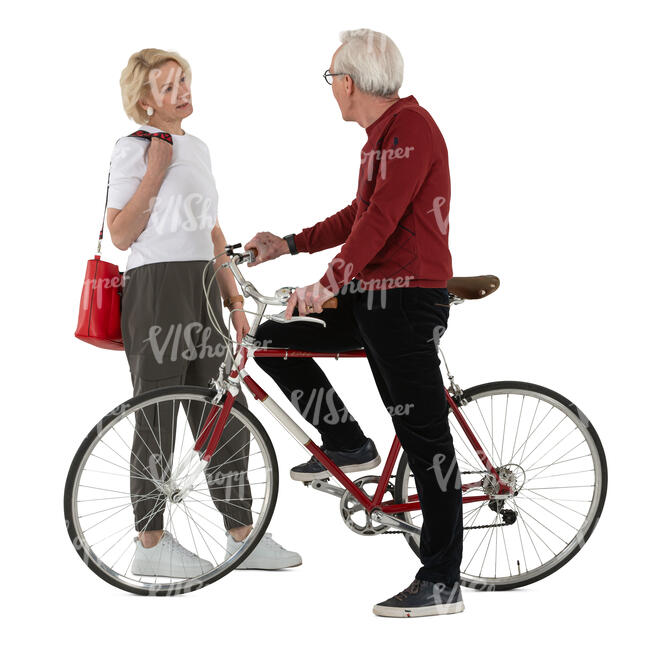 grey haired man with a bike talking to a woman