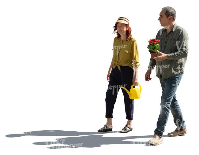 two backlit senior people going to plant flowers