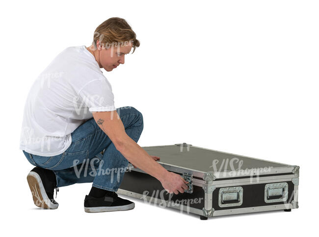 man packing up a large equipment box
