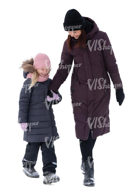 cut out woman and child walking hand in hand on a winter day