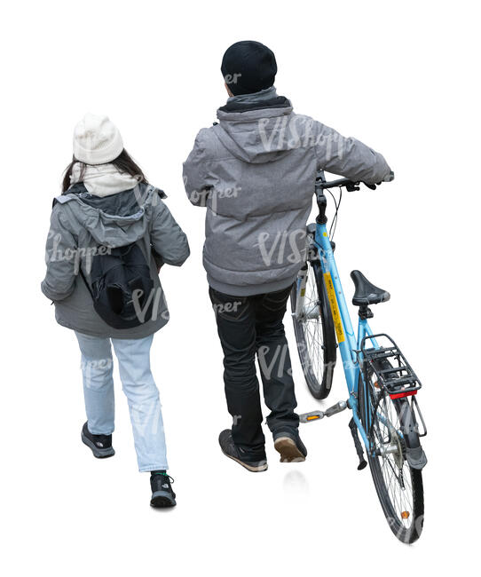 top view of two people in autumn walking with a bike