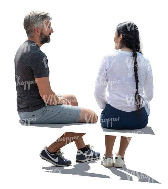 backlit man and woman sitting