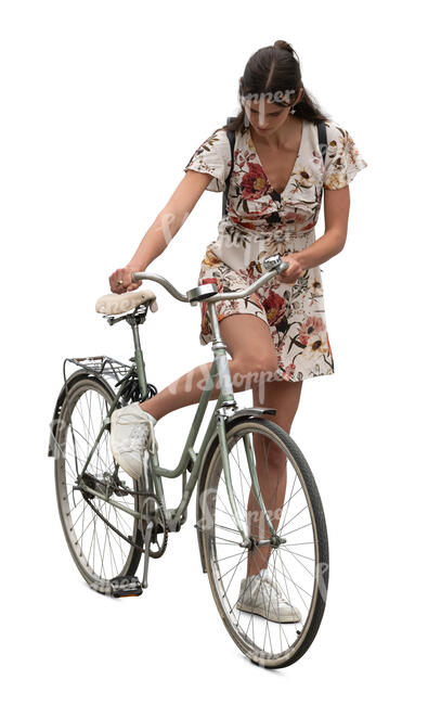 woman starting to ride a bicycle