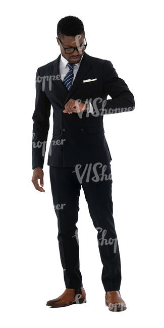 cut out chic black man wearing a suit standing and checking his wrist watch