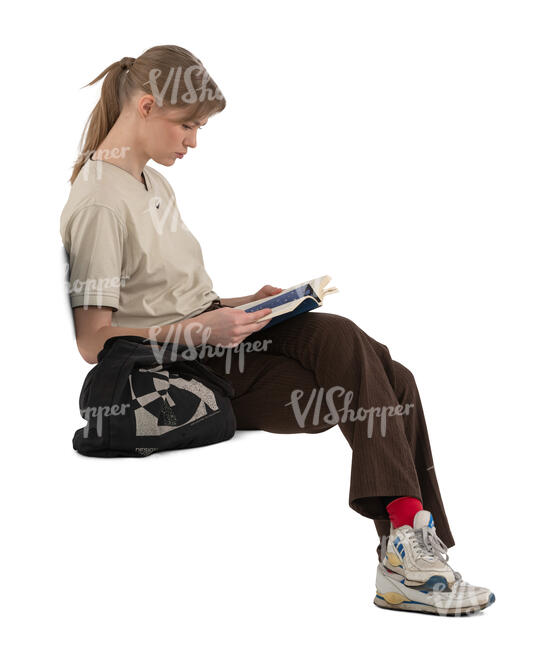 woman sitting and reading a book